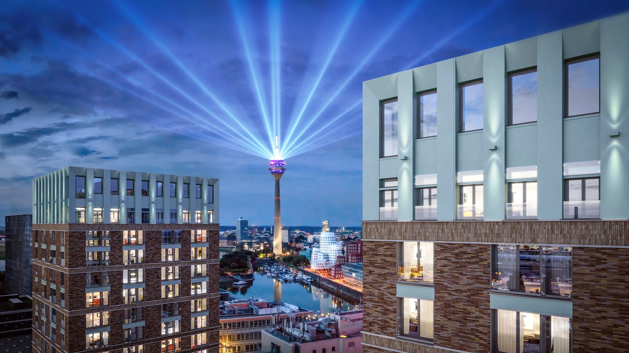 Nächtlicher Blick vom WIN WIN im Medienhafen Düsseldorf auf den Rheinturm mit Lichtstrahlen über dem Hafenbecken und den Gehry-Bauten.