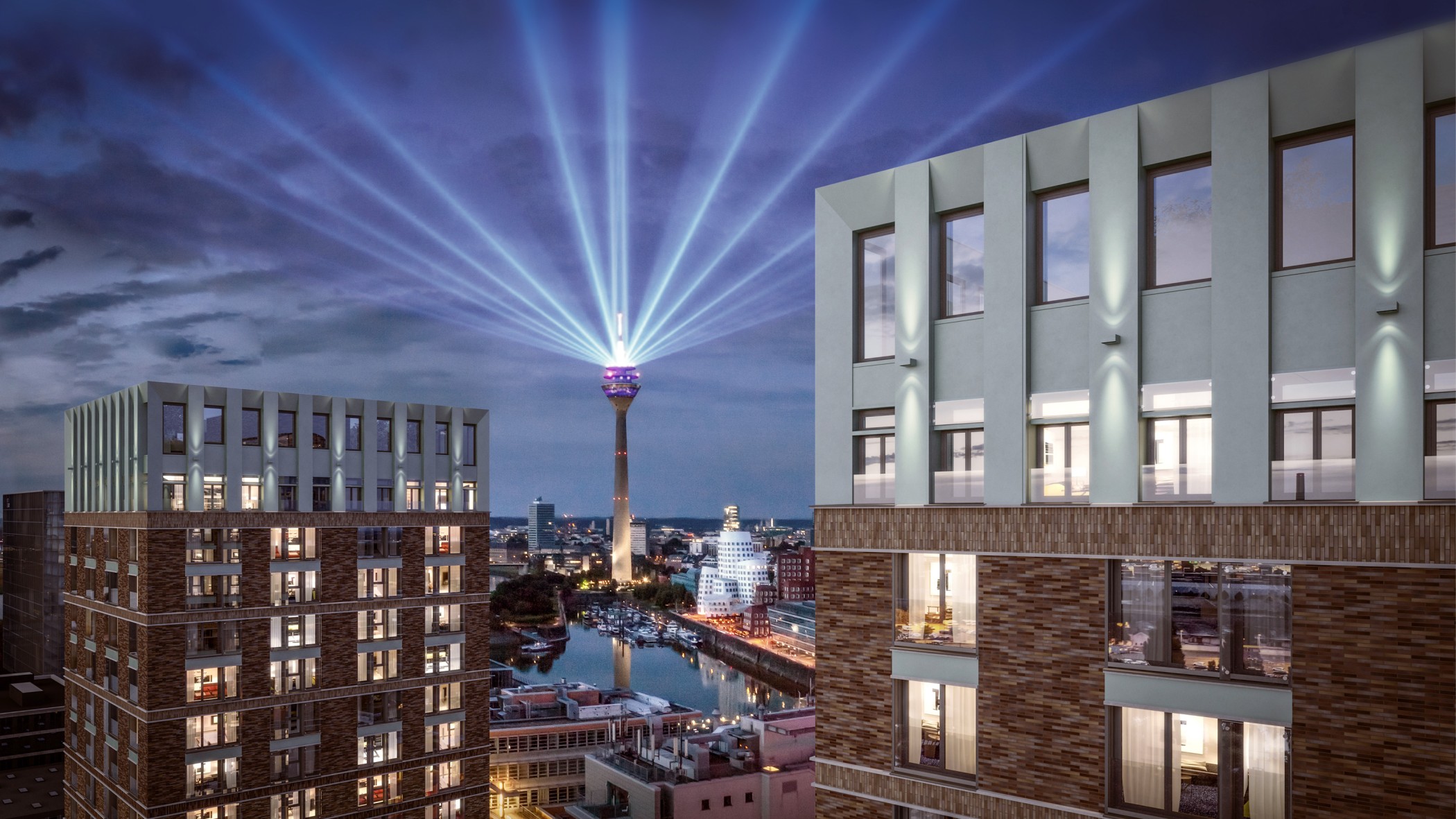 Nächtlicher Blick vom WIN WIN im Medienhafen Düsseldorf auf den Rheinturm mit Lichtstrahlen über dem Hafenbecken und den Gehry-Bauten.
